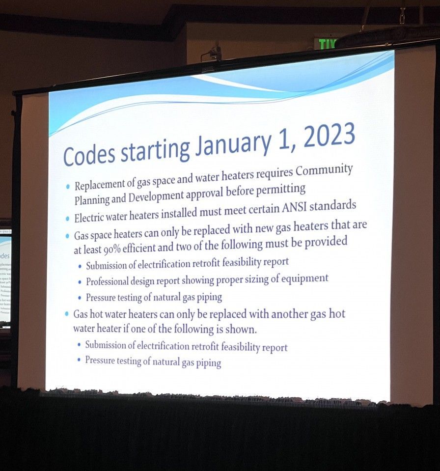 Presentation slide listing new codes for gas and electric water heaters starting January 1, 2023.