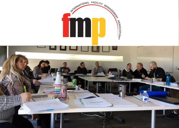 Group of people in a classroom setting, the logo 