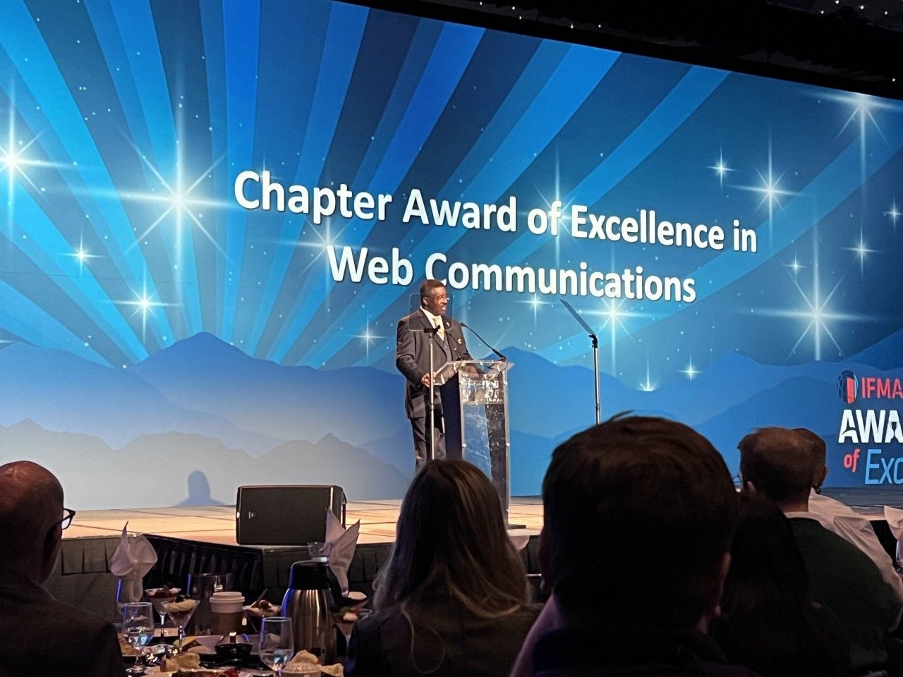 Man speaking at a podium,