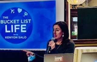 Woman speaking into a microphone with