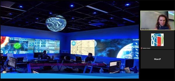 A control room with multiple screens