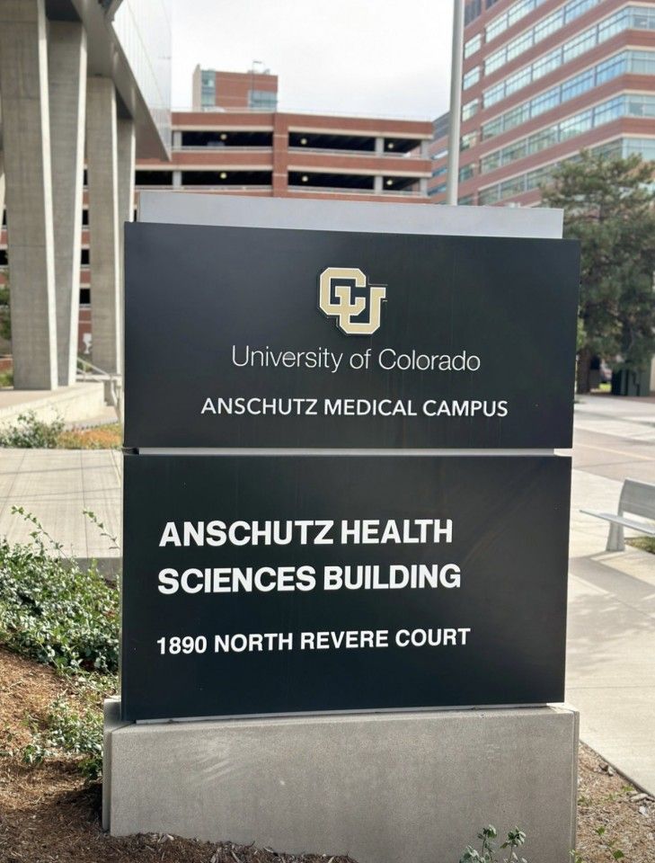 Sign for the University of Colorado Anschutz Medical Campus, in black, with text in white and gold.