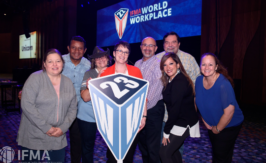 Group of people holding a large 