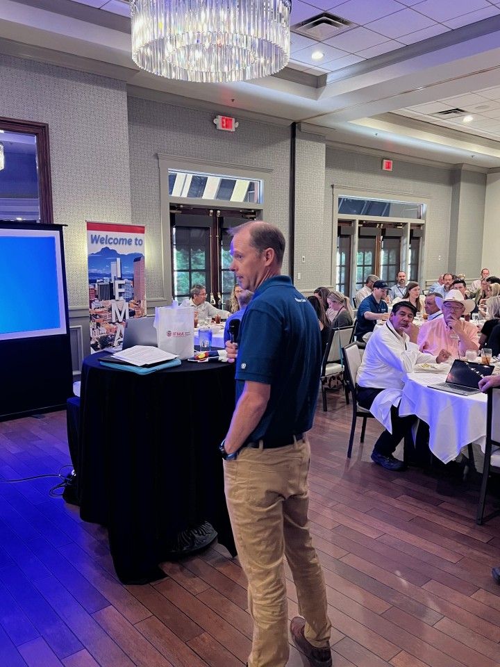 Man giving a presentation at a conference.