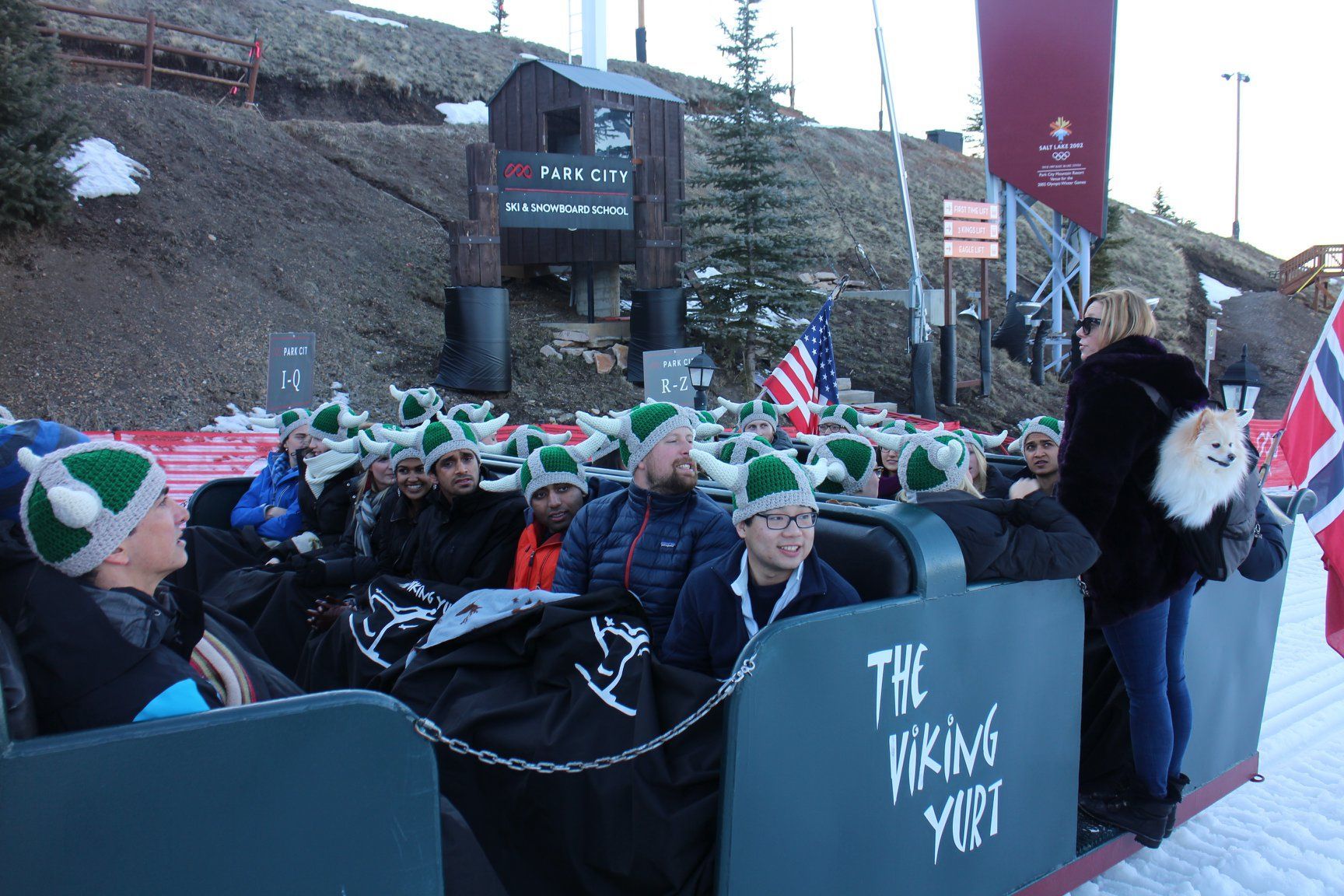 group in sleigh wearing knitted viking hats