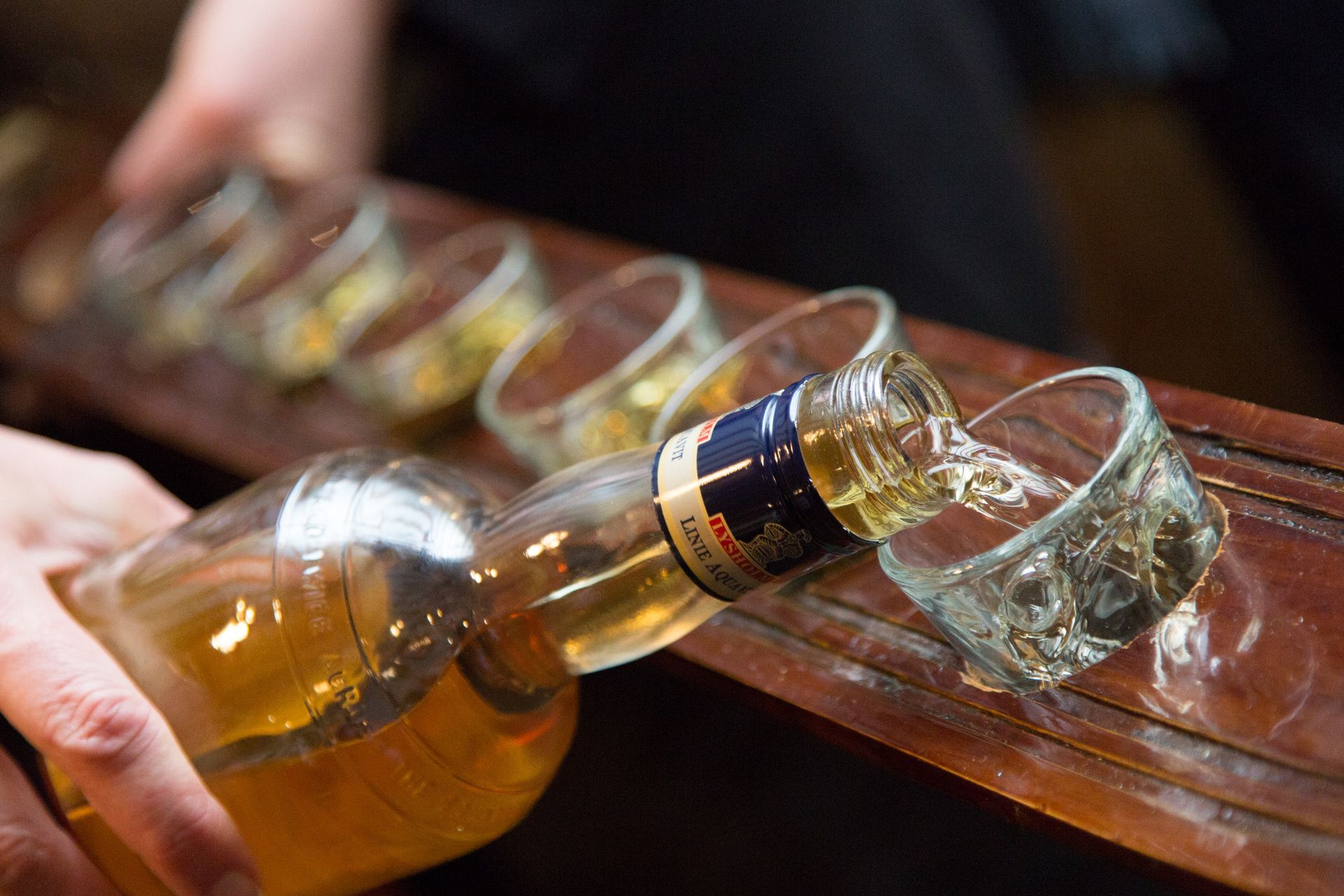pouring a flight of alcohol