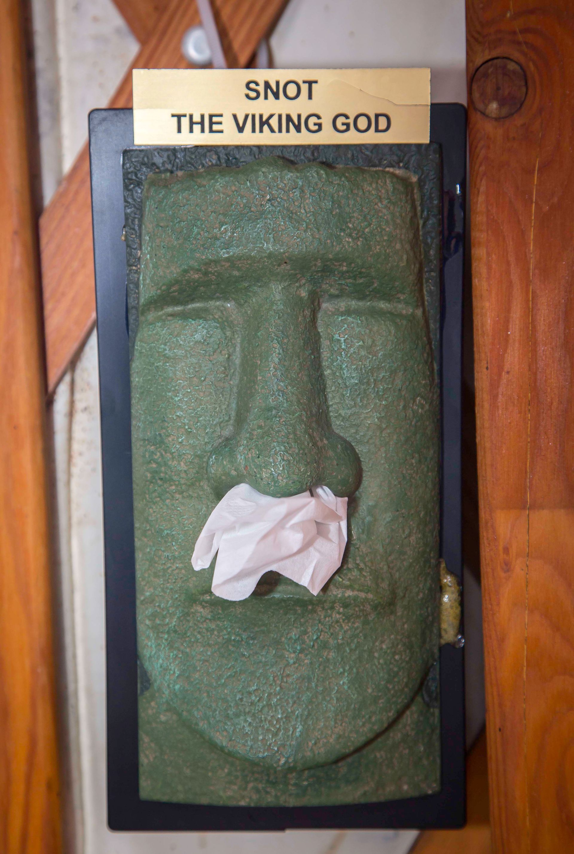 statue with tissue in nose