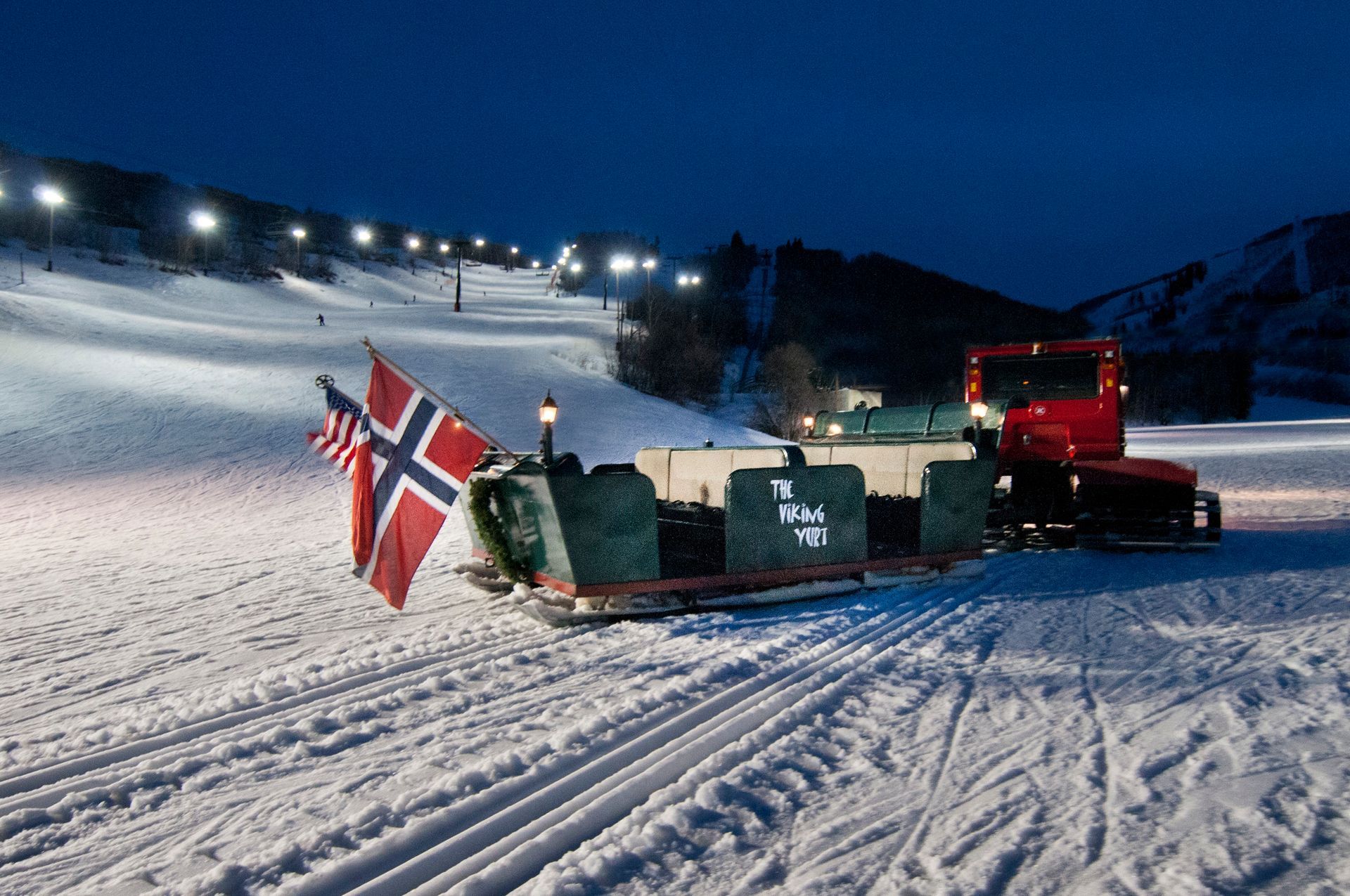sleigh and snow cat at night