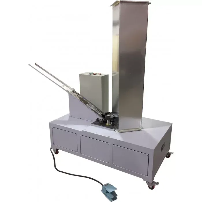 A machine with a stainless steel tower on top of it