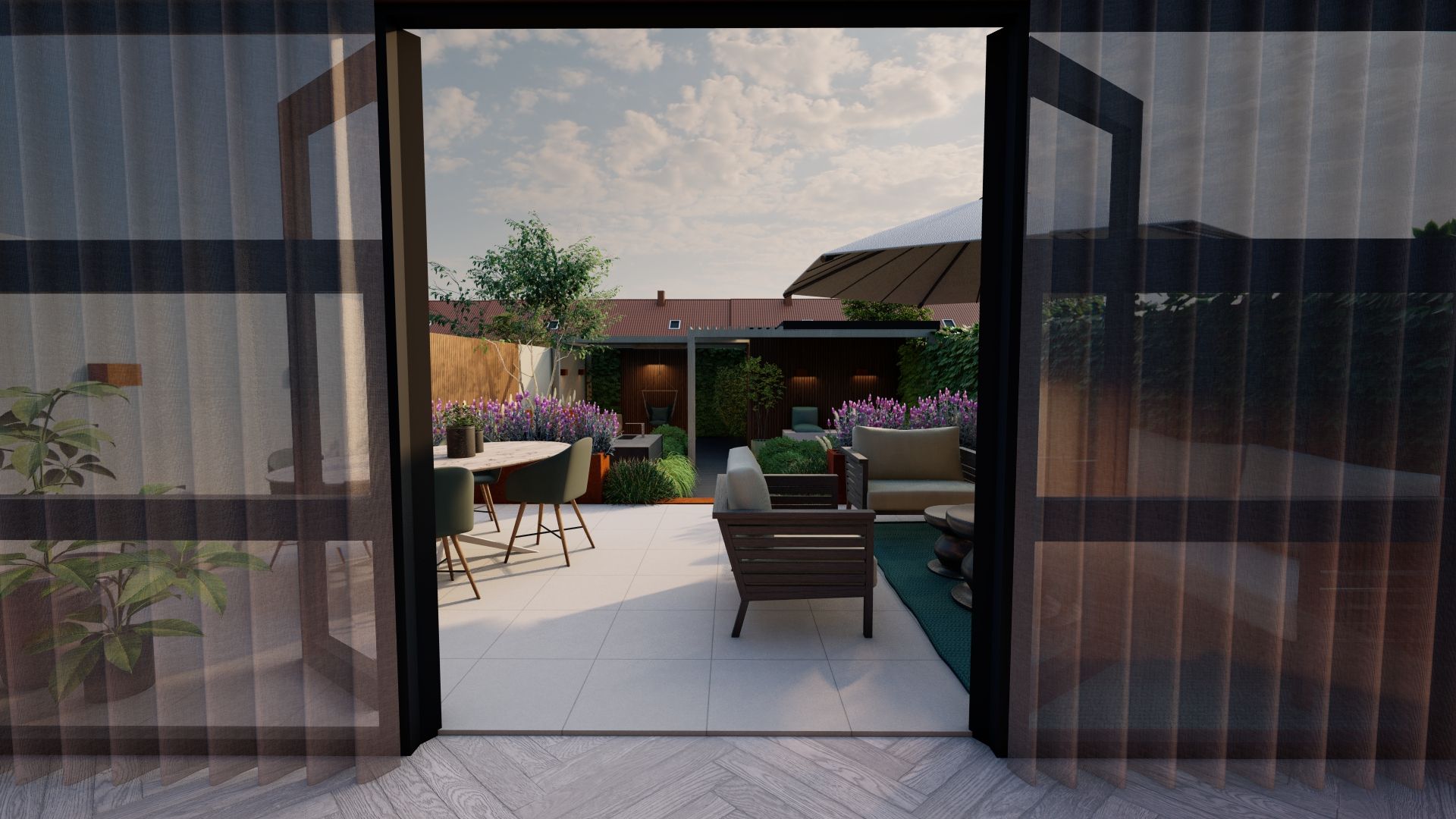 Uitzicht op een terras vanuit de woonkamer door een glazen deur.