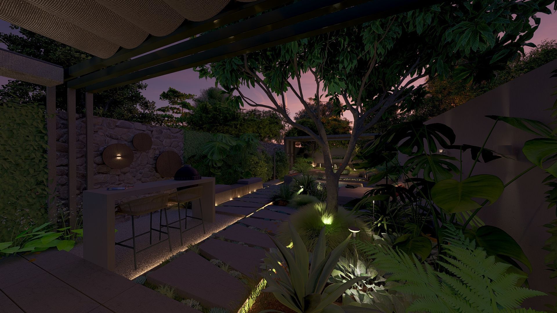 Een pad van betontegels met sedum ertussen langs een border met een boom en beplanting en verlichting