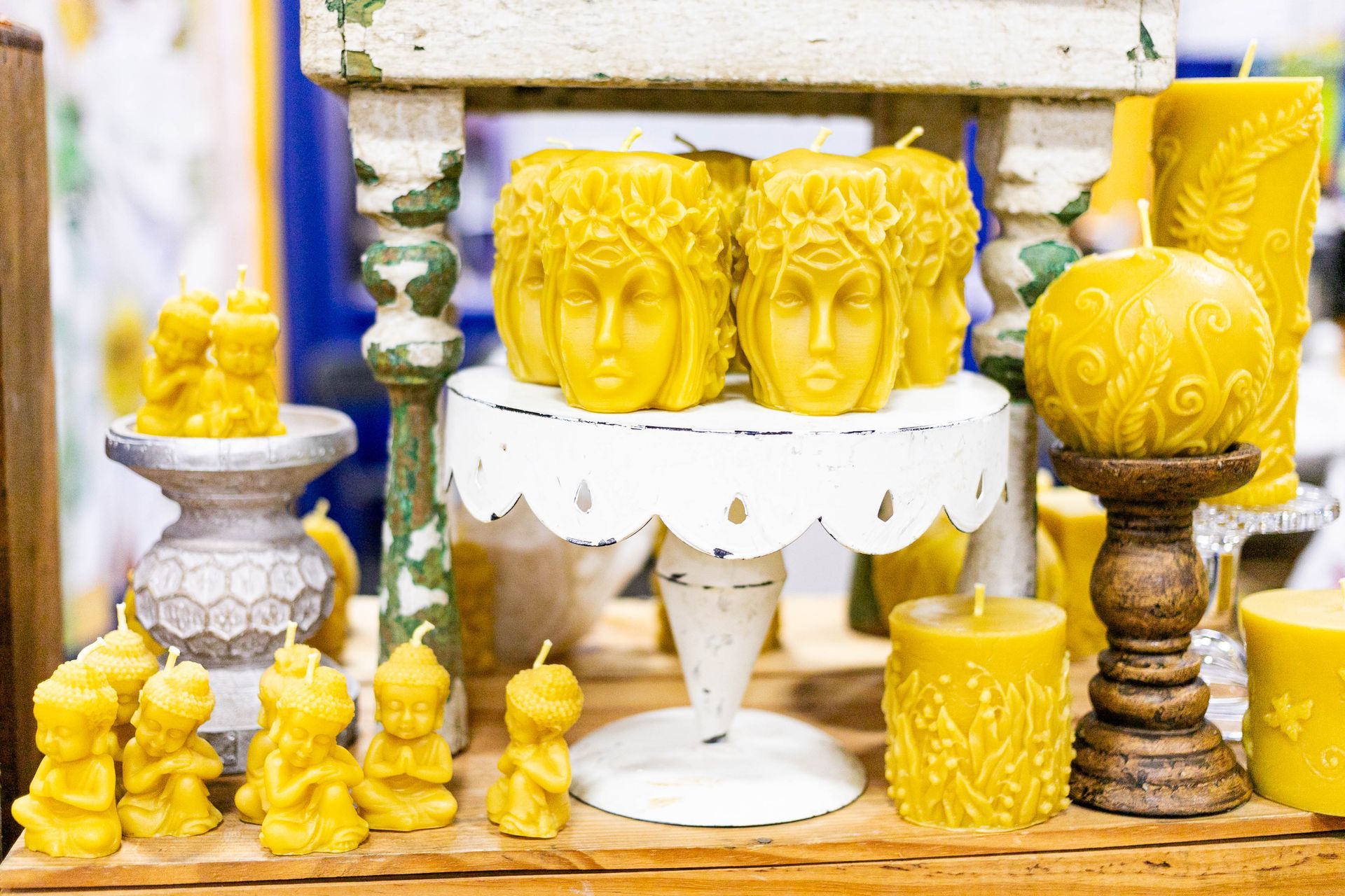 Two women are looking at stuffed animals in front of a sign that says free samples