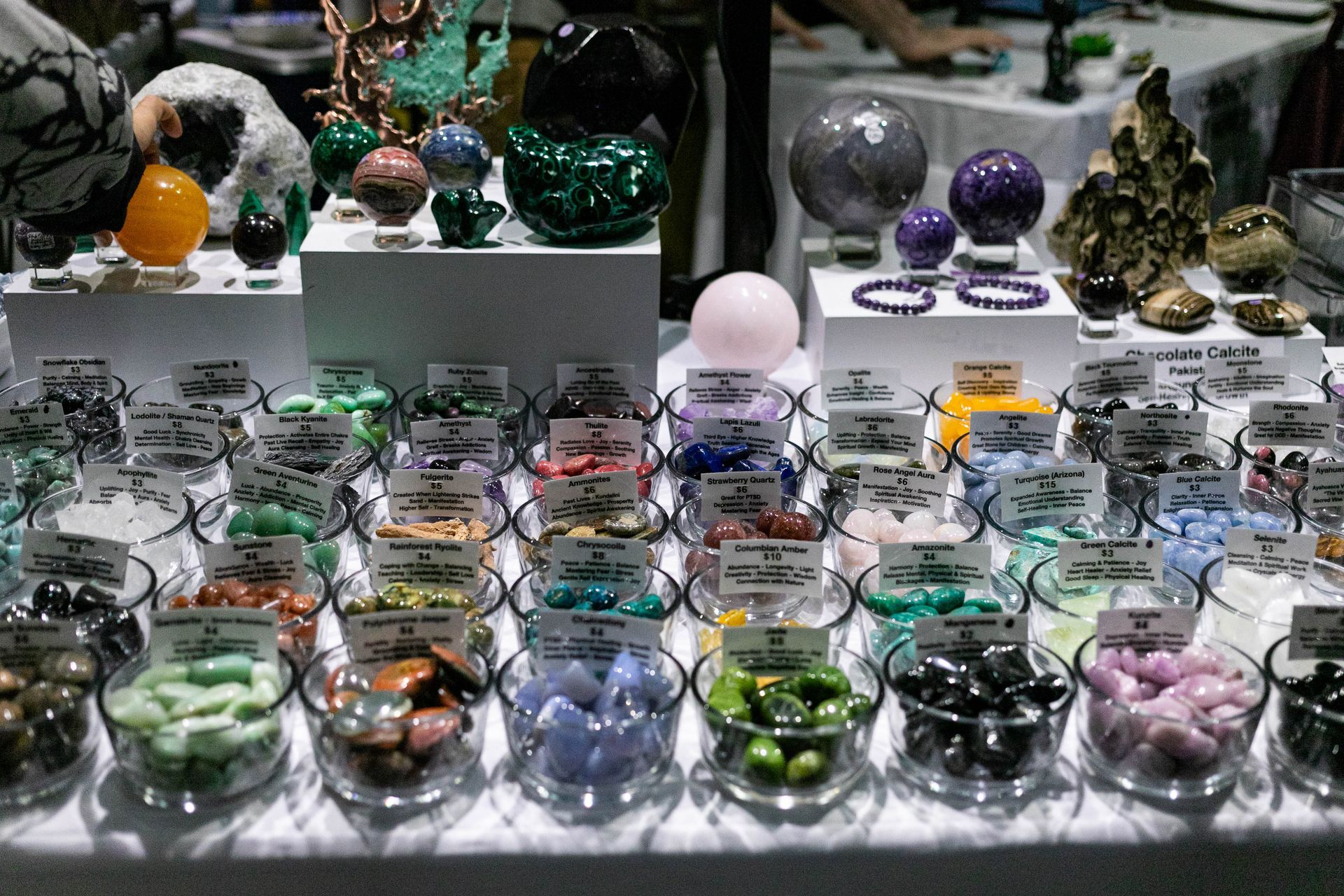 A group of people are standing around a table with a sign that says 3d on it