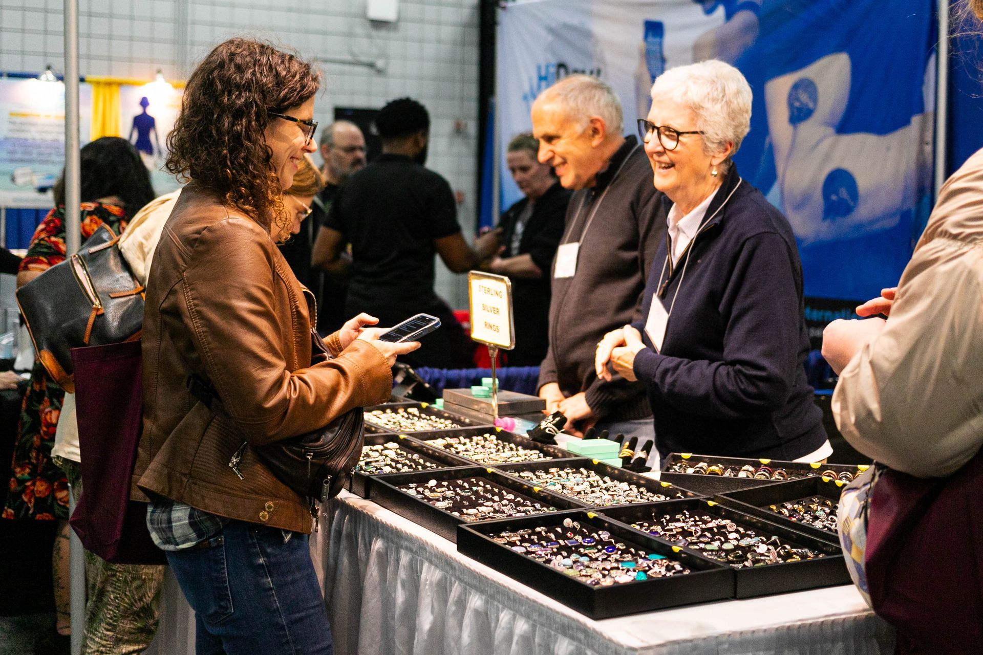A group of people are standing outside of the royal plaza trade center