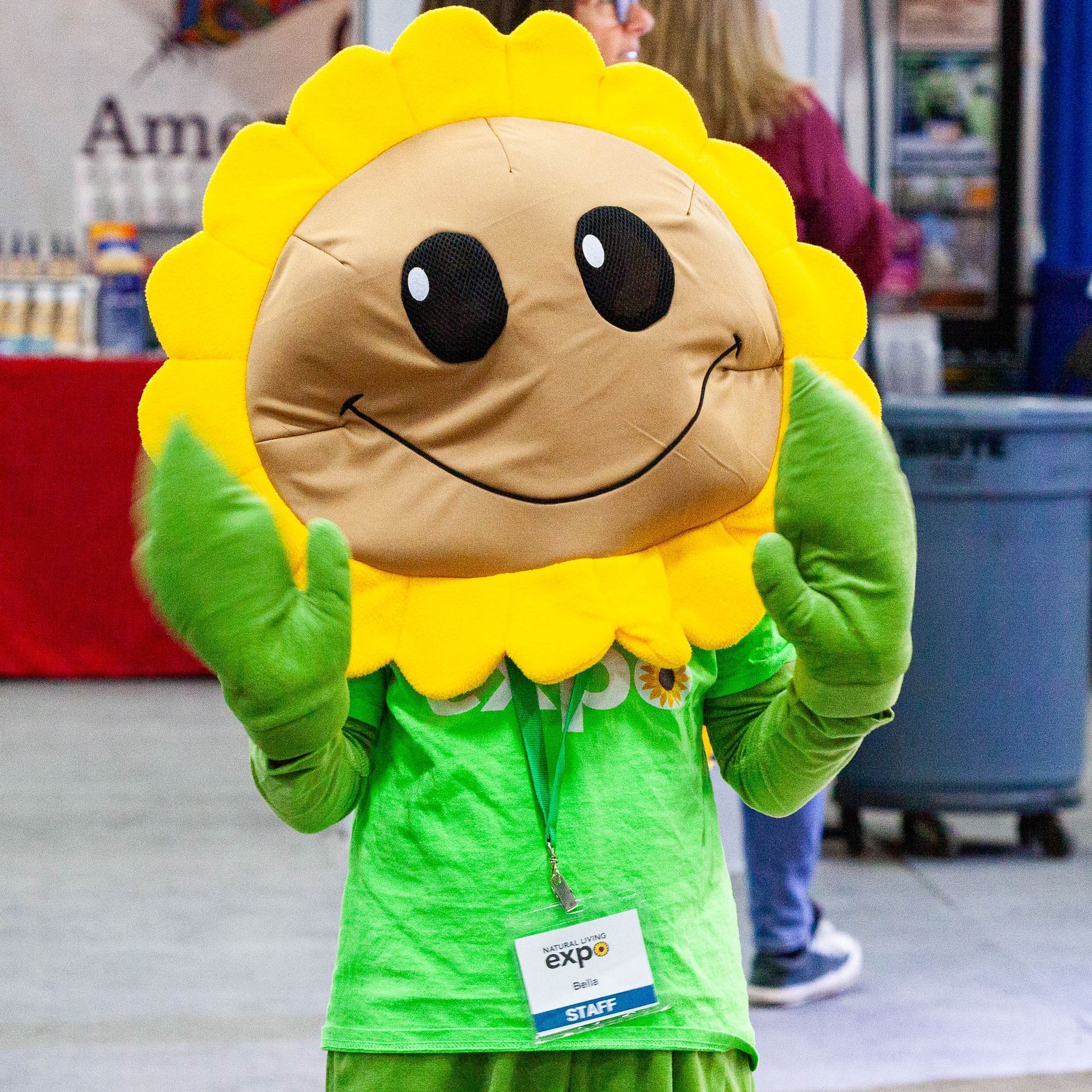 A woman stands in front of a sign that says best