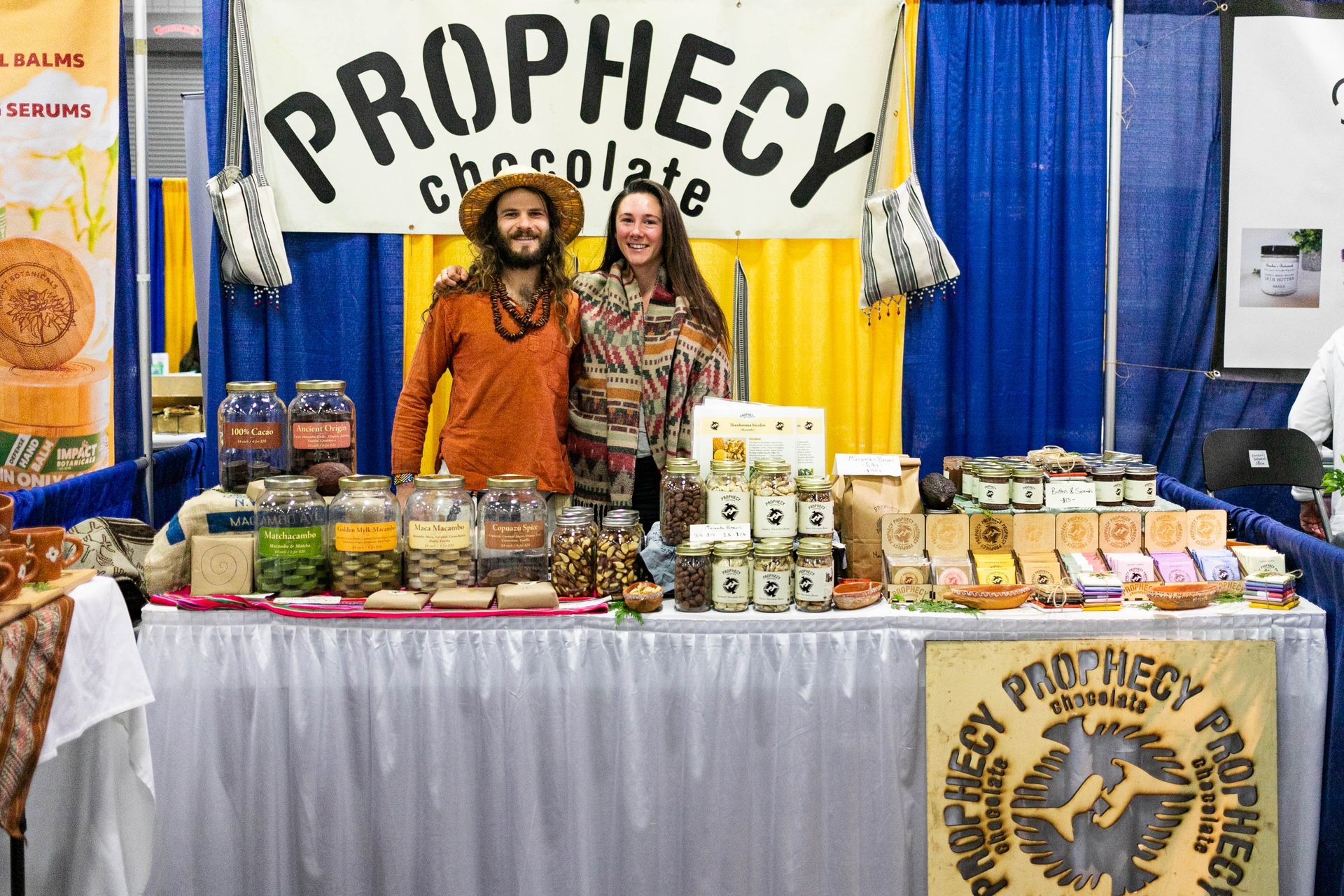 A group of people sitting in front of a sign that says hug patrol