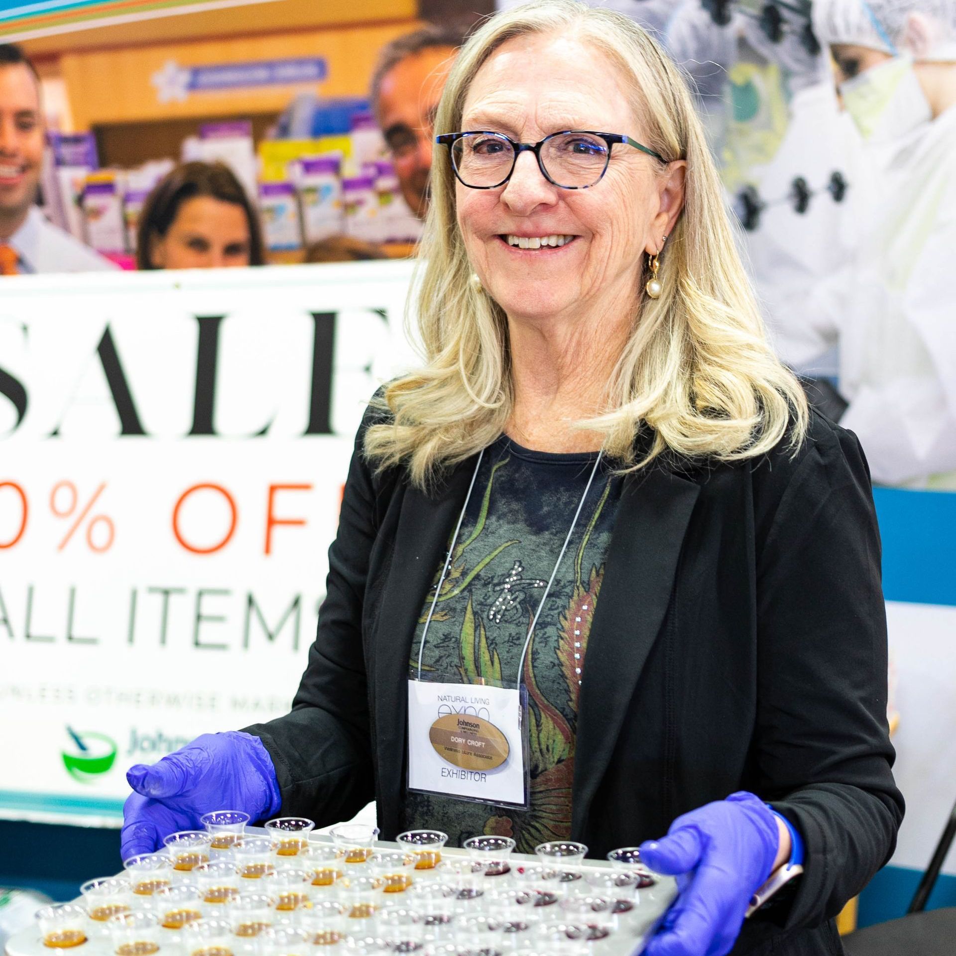 A man wearing a black shirt that says kale on it