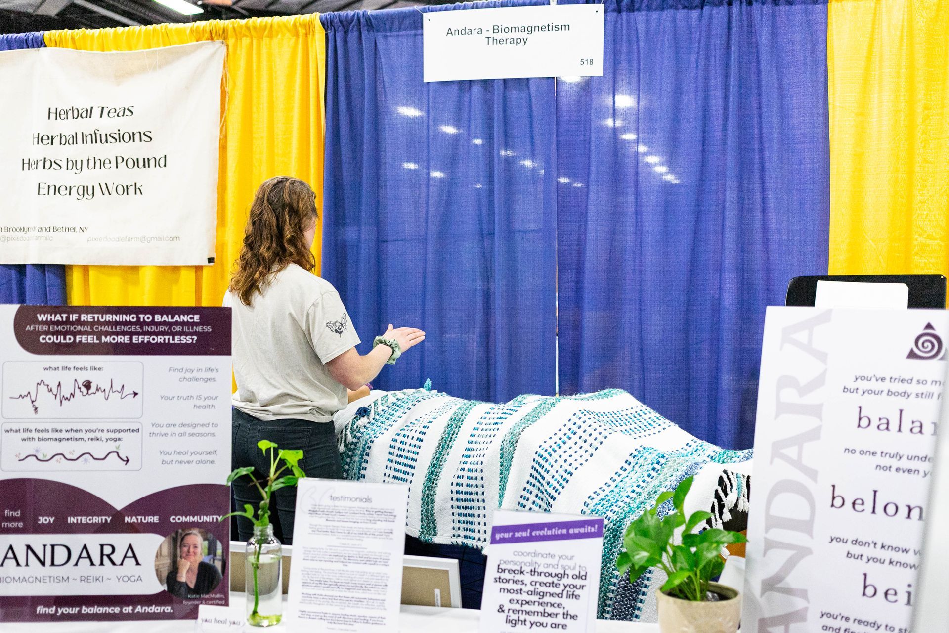 A woman laying on the floor with a bag that says oxa on it