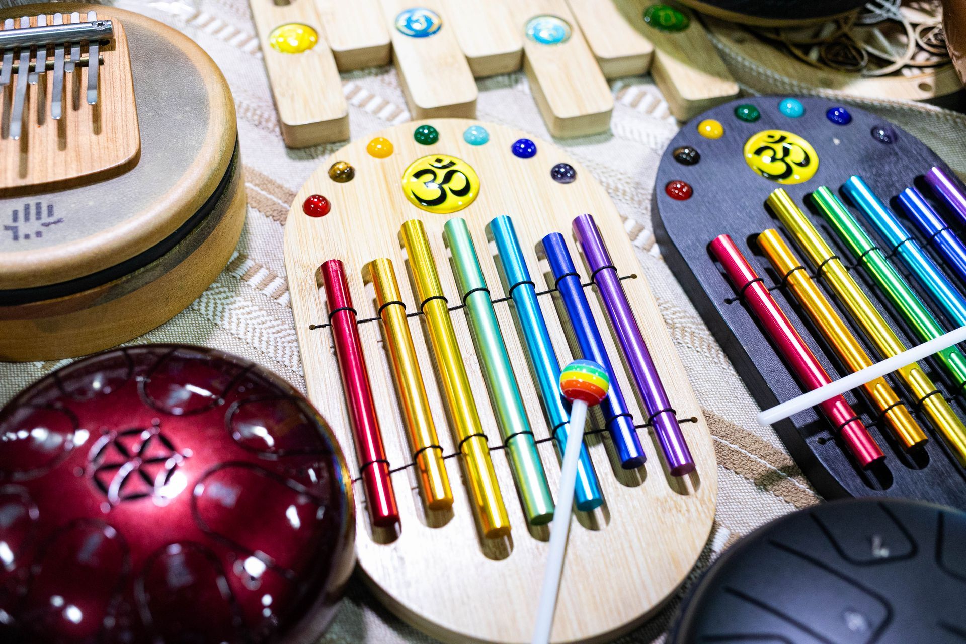 A stack of brass bowls with a bell on top of them