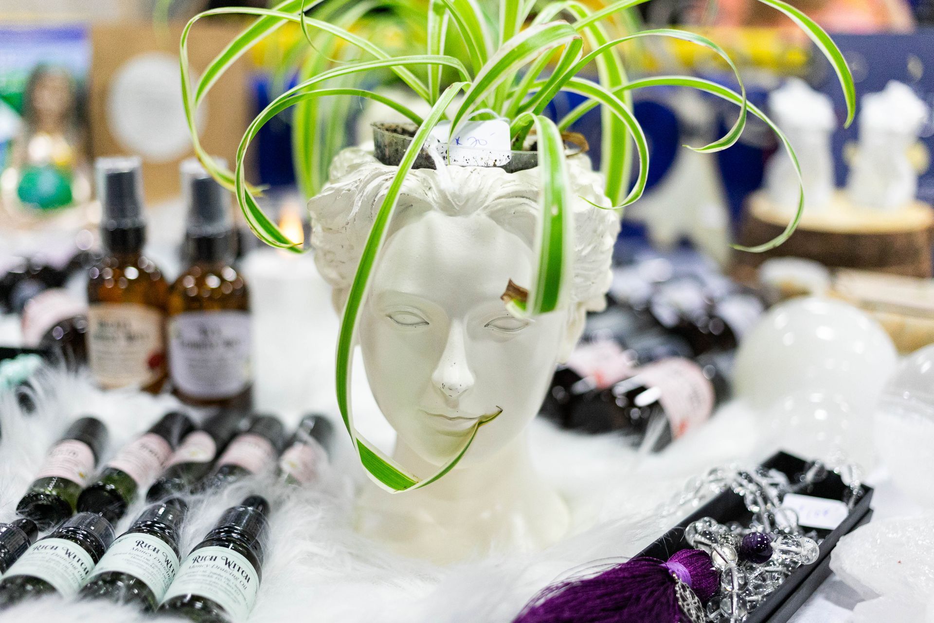 Two people standing in front of a table that says healing