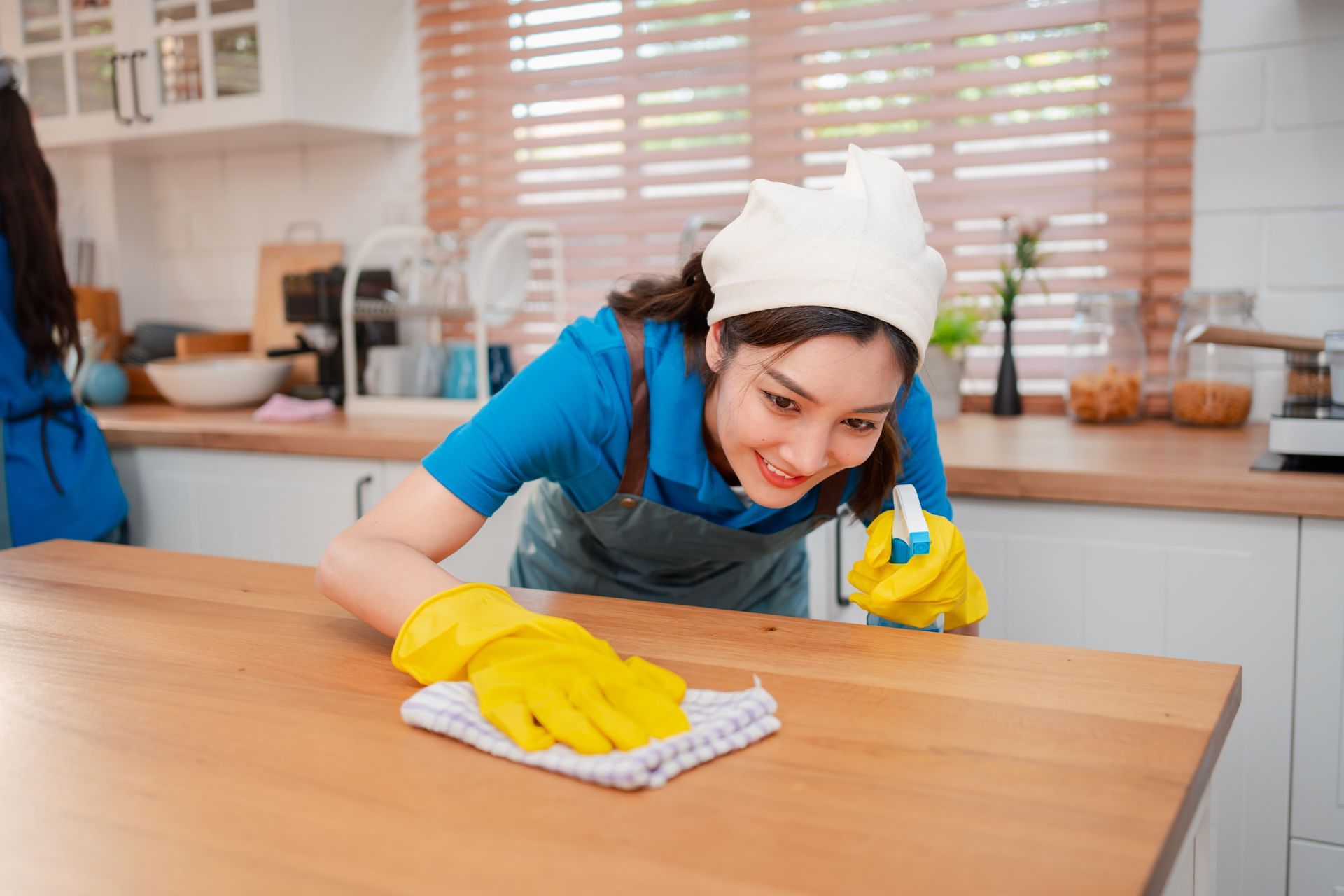 Woman cleaning the apartment table