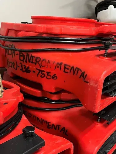 Stacked red industrial air movers with 