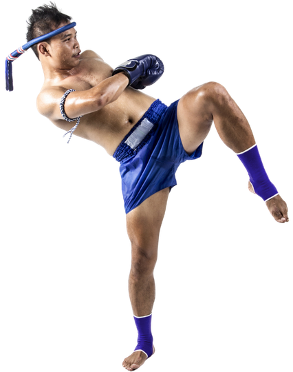 A man in blue shorts and boxing gloves is kicking in the air.
