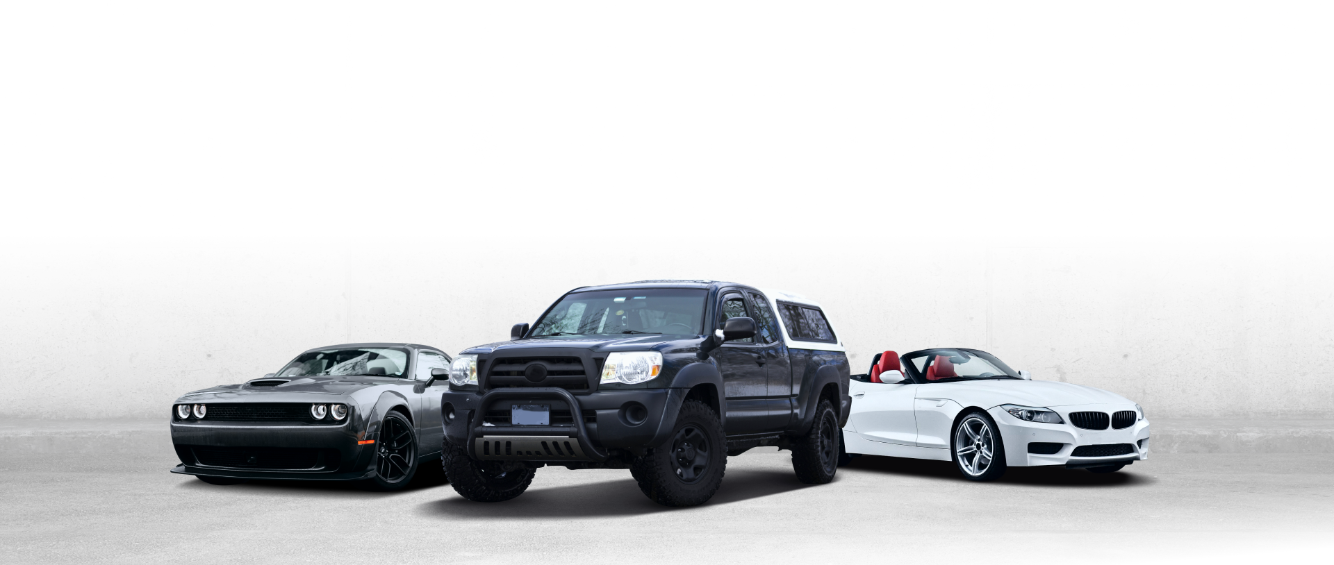 Three cars are displayed: a dark truck, a gray SUV, and a gray sedan, against a white background | Mike's Automotive AC