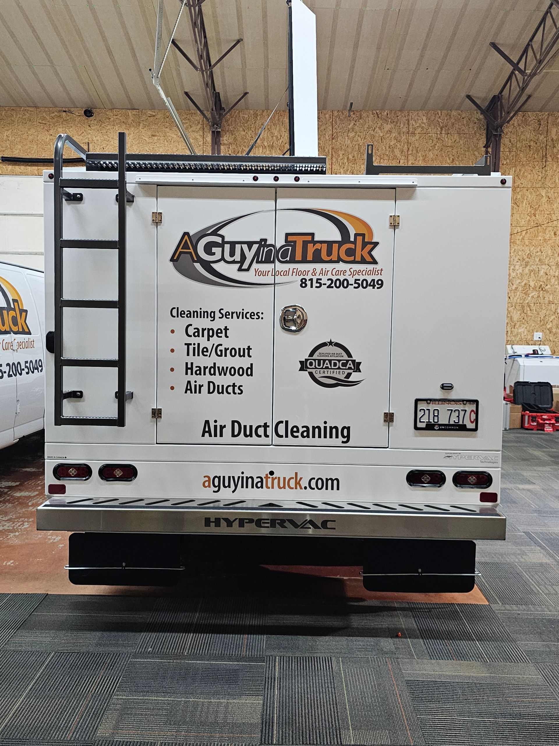 Back view of A Guy in a Truck air duct cleaning vehicle with service details displayed.