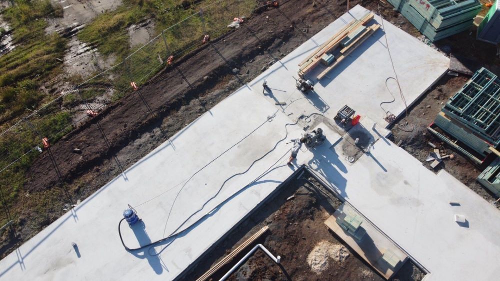 An Aerial View of a Construction Site With People Working on It — Jason Walsh Constructions in Lismore, NSW