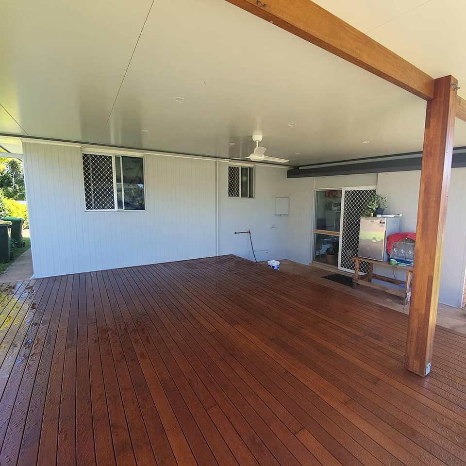 There is a wooden deck with a ceiling fan on it — Jason Walsh Constructions in Alstonville, NSW