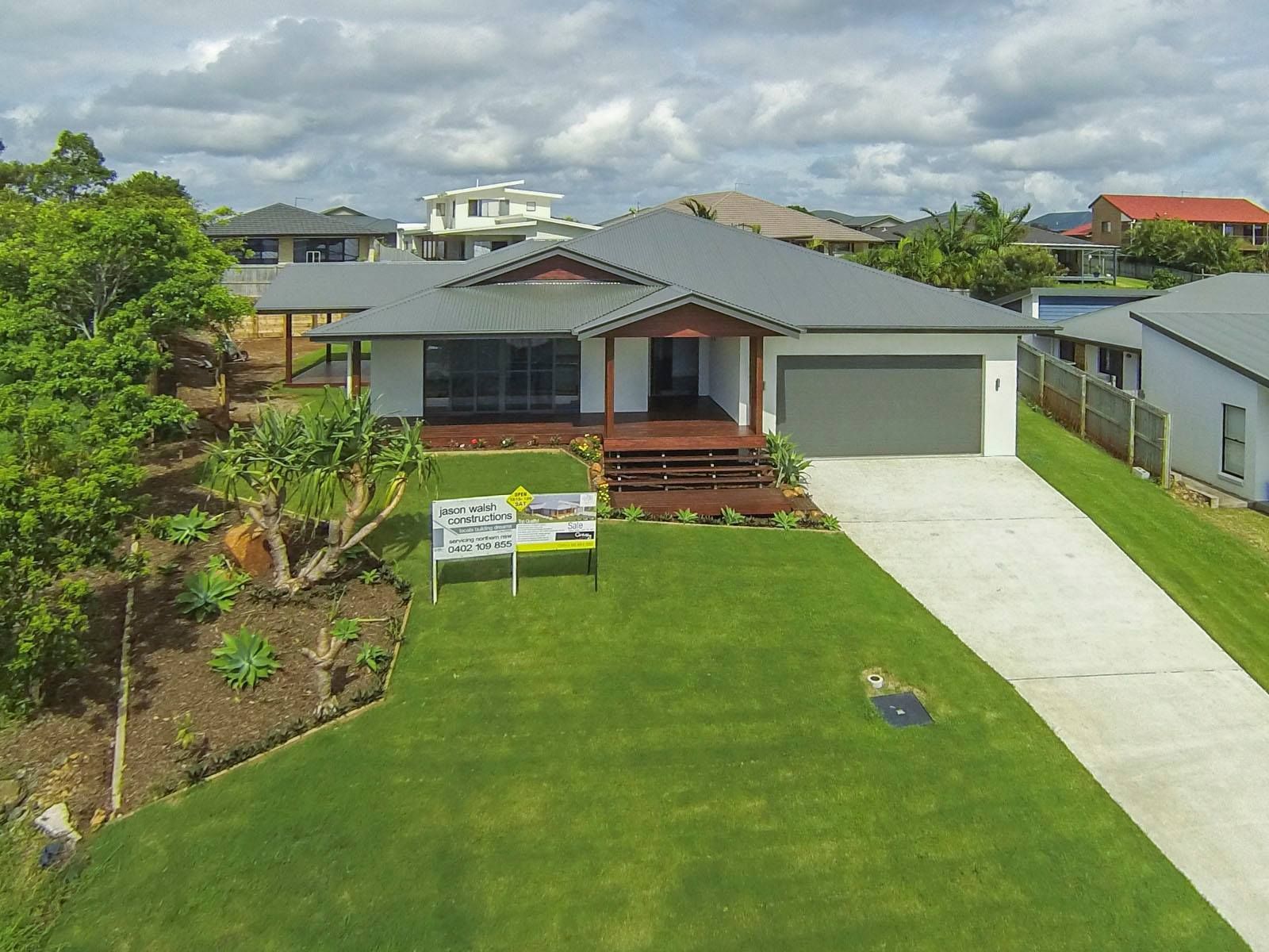 An aerial view of a house with a large lawn — Jason Walsh Constructions in Alstonville, NSW