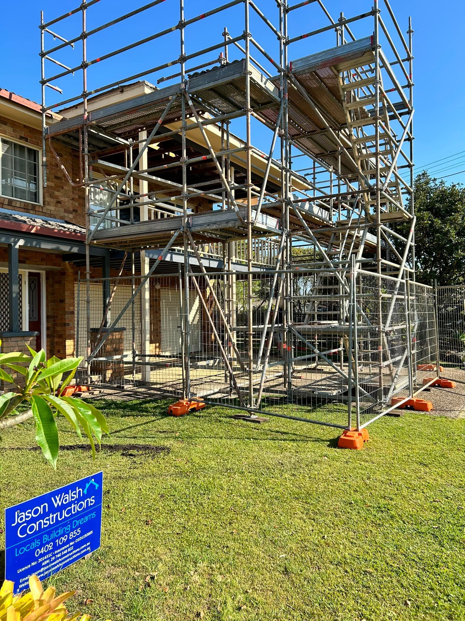 A house is being remodeled with scaffolding in front of it — Jason Walsh Constructions in Goonellabah, NSW