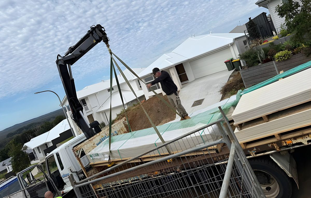 Truck Crane Lifting Construction Materials — Jason Walsh Constructions in Alstonville, NSW