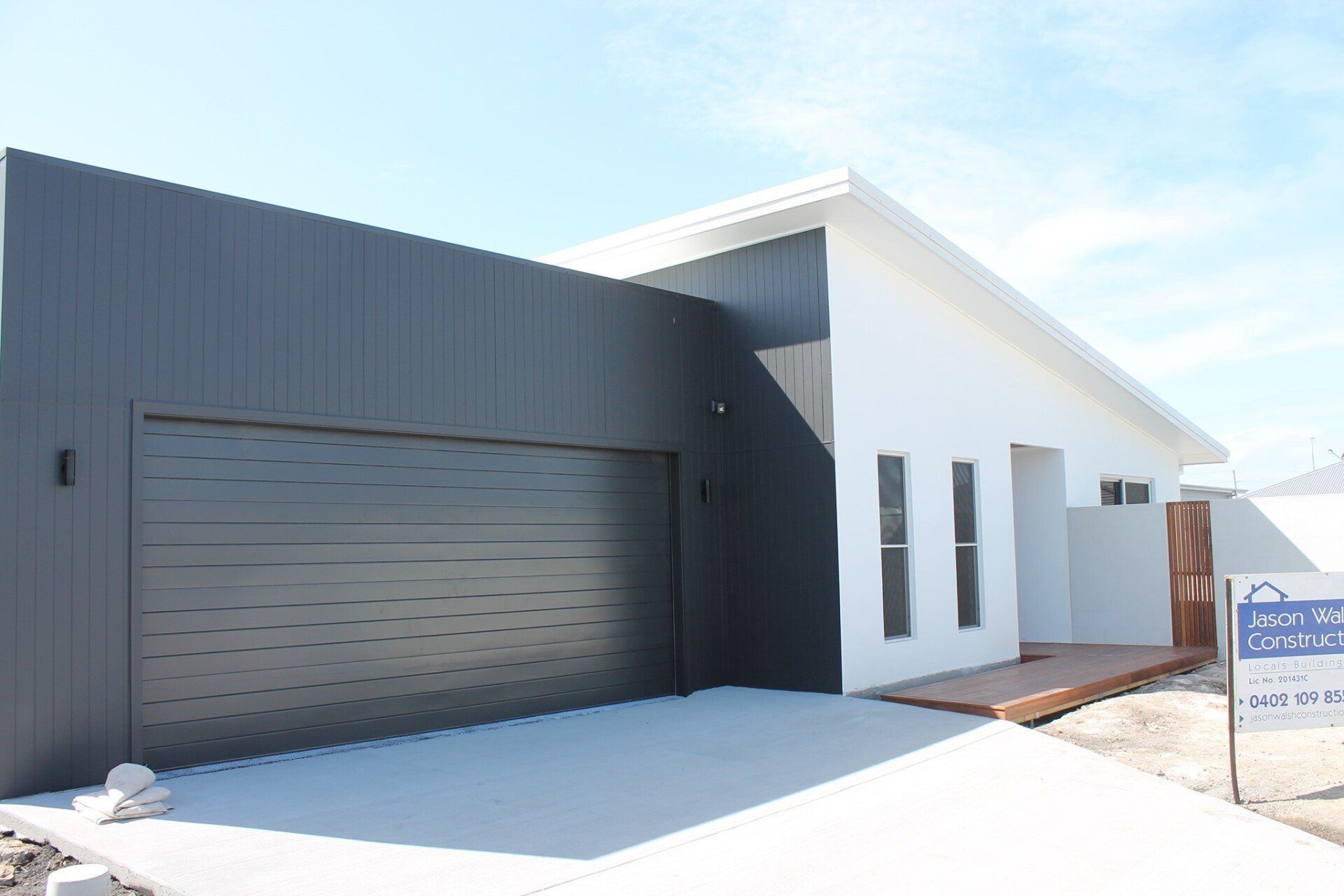 A White House With a Black Garage Door is for Sale — Jason Walsh Constructions in Alstonville, NSW