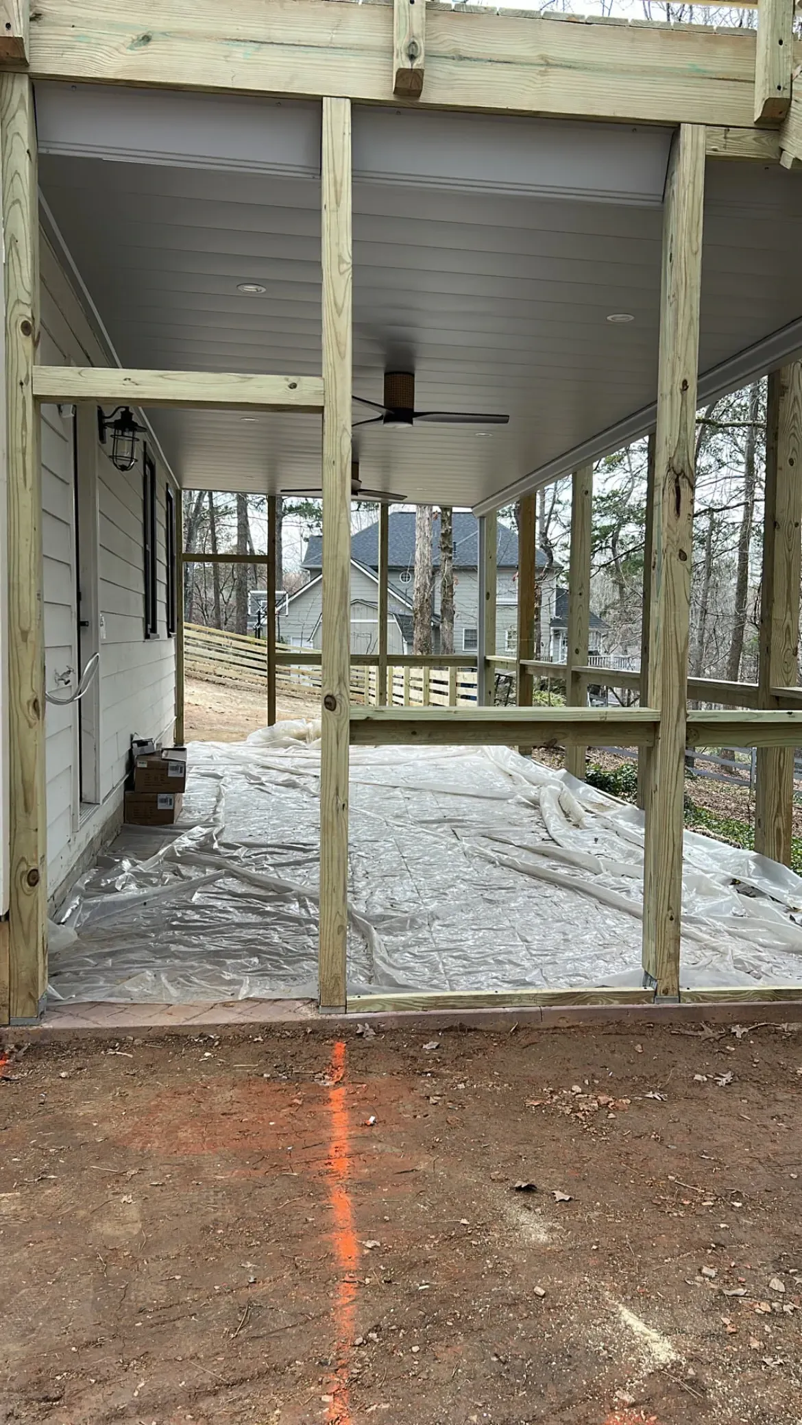 After installing white aluminum dry below deck system with two ceiling fans and LED lighting features.