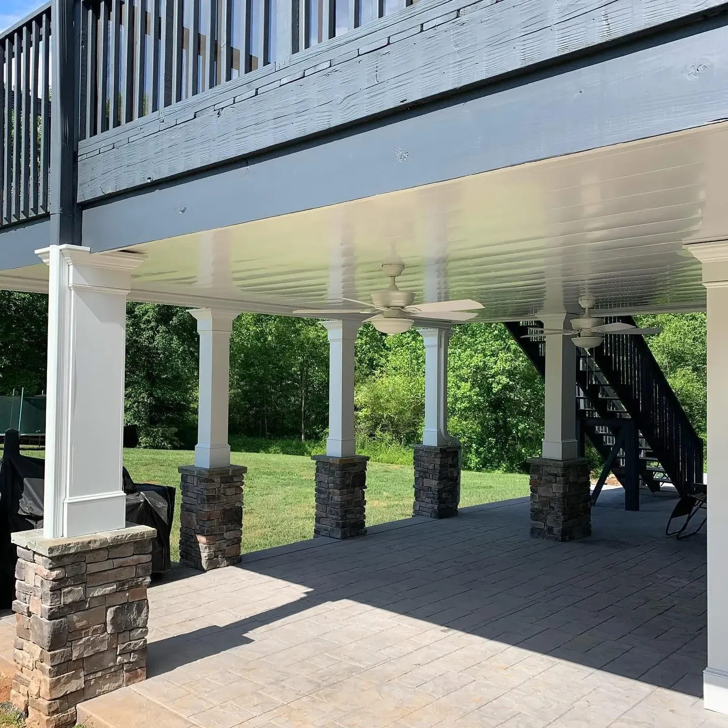 After installing white aluminum underneath deck ceiling with two added ceiling fans.