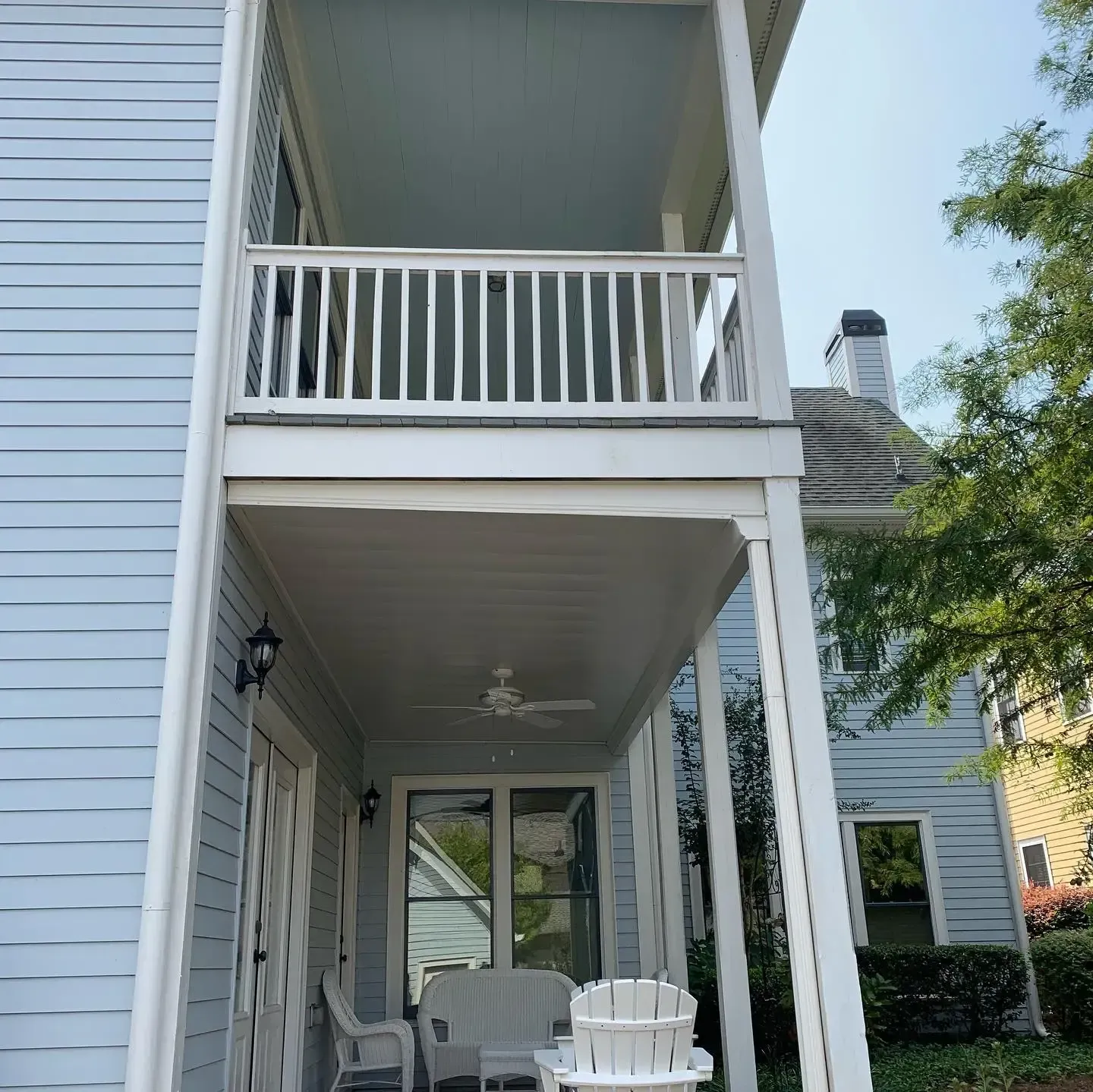 After installing white colored aluminum under deck system with ceiling fan and outdoor lighting features.