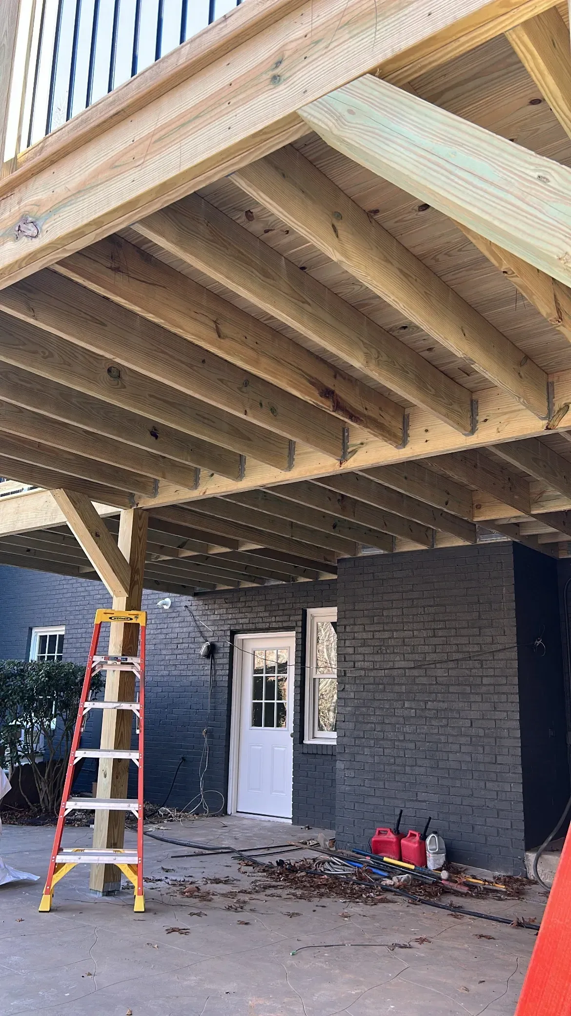 Before installing white aluminum under deck ceiling panels.