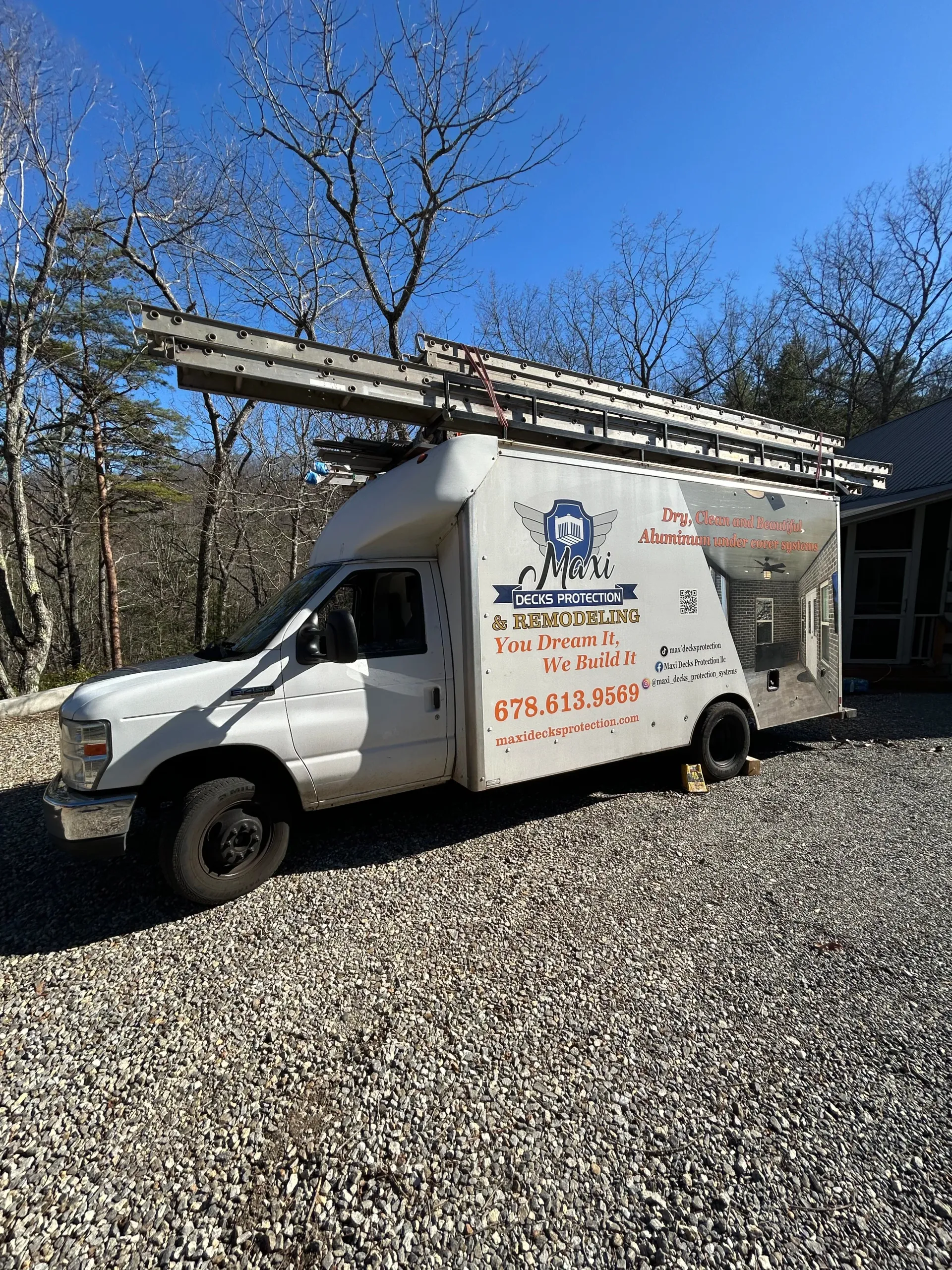 Maxi Decks Protection work truck parked at under deck ceiling installation job-site.