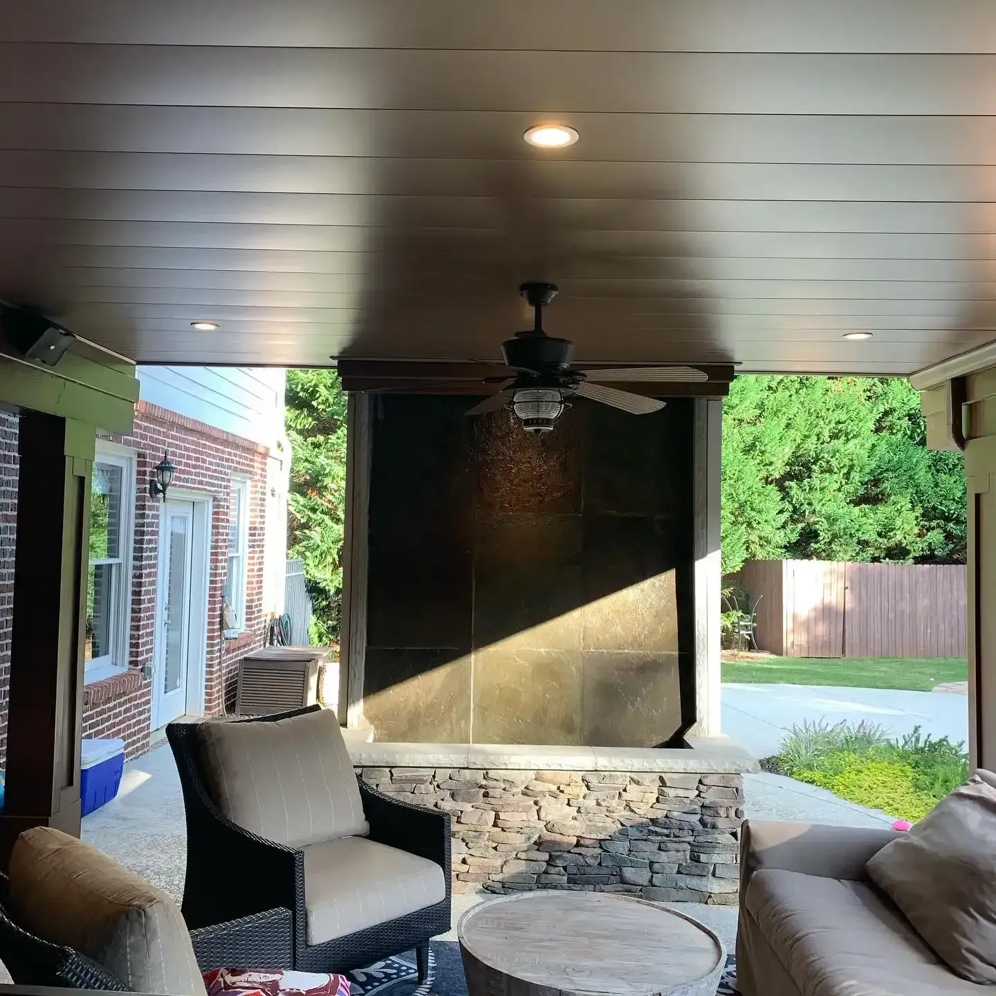 Aluminum under deck ceiling installed by Maxi Decks Protection with a built in ceiling fan and LED lighting features.