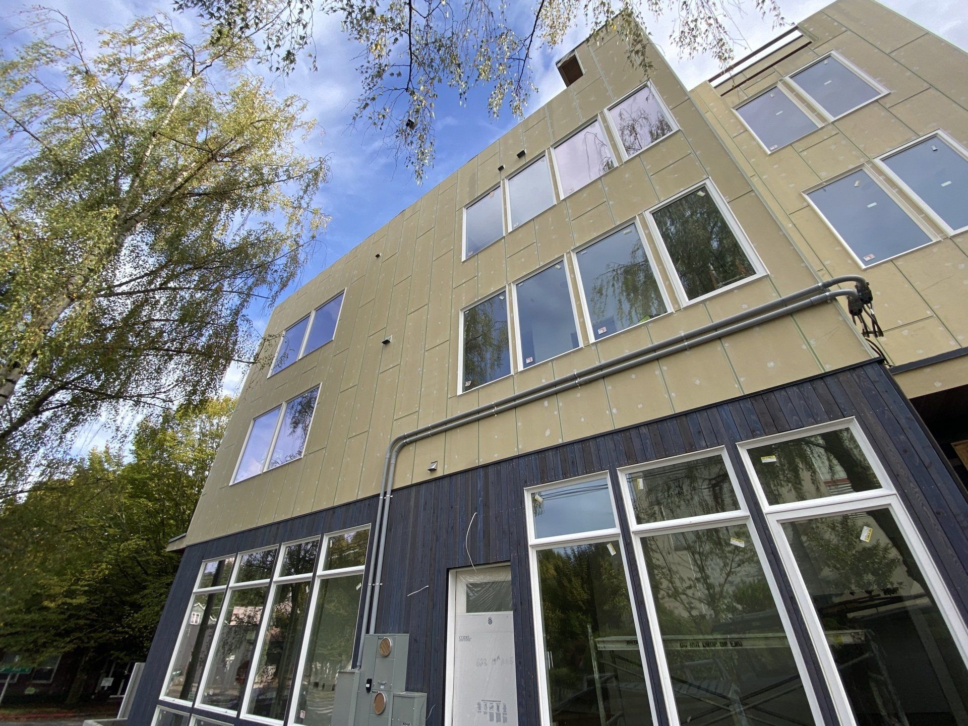 Looking up at a large building with lots of windows