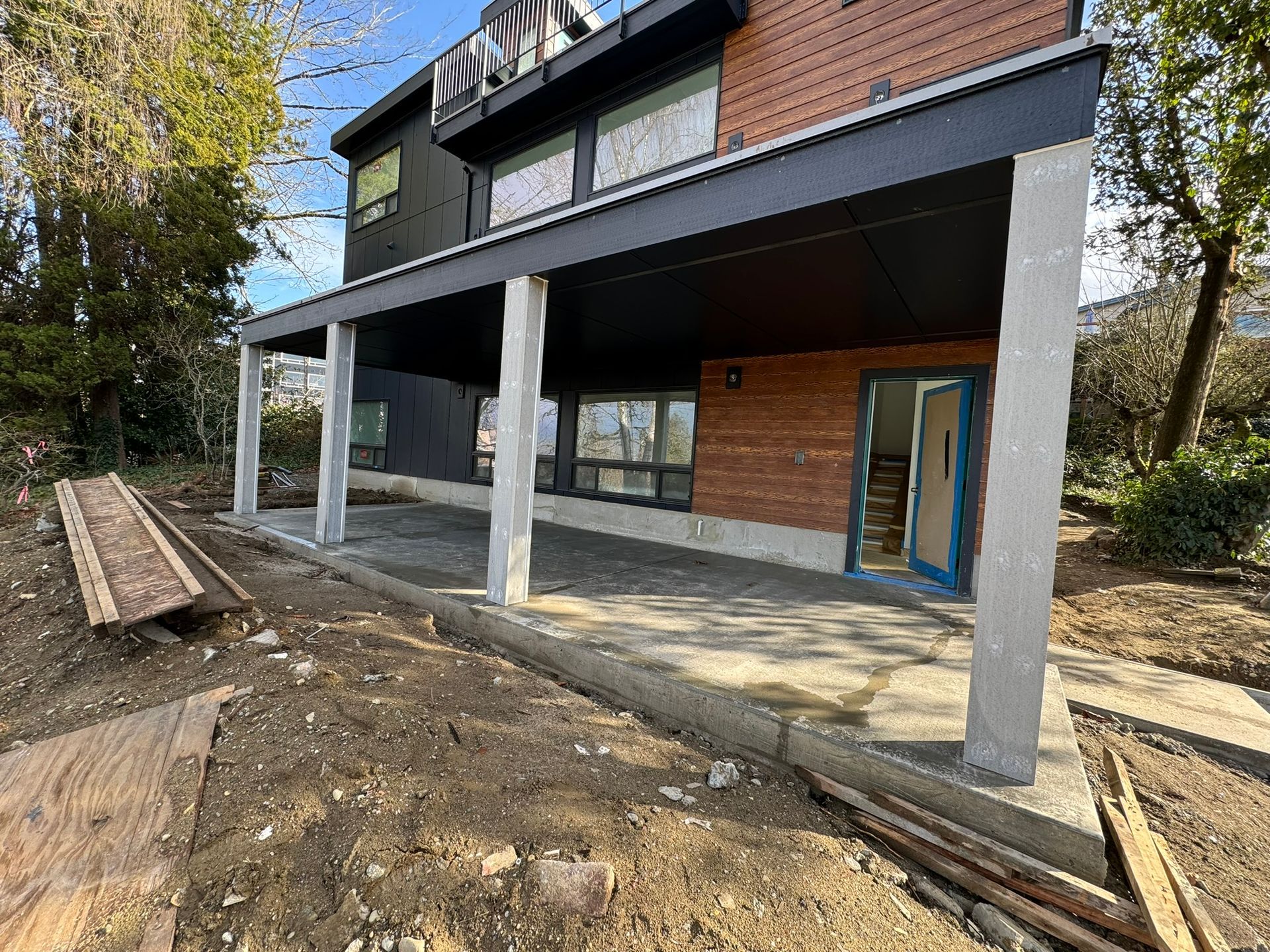 A large building under construction with a large porch.