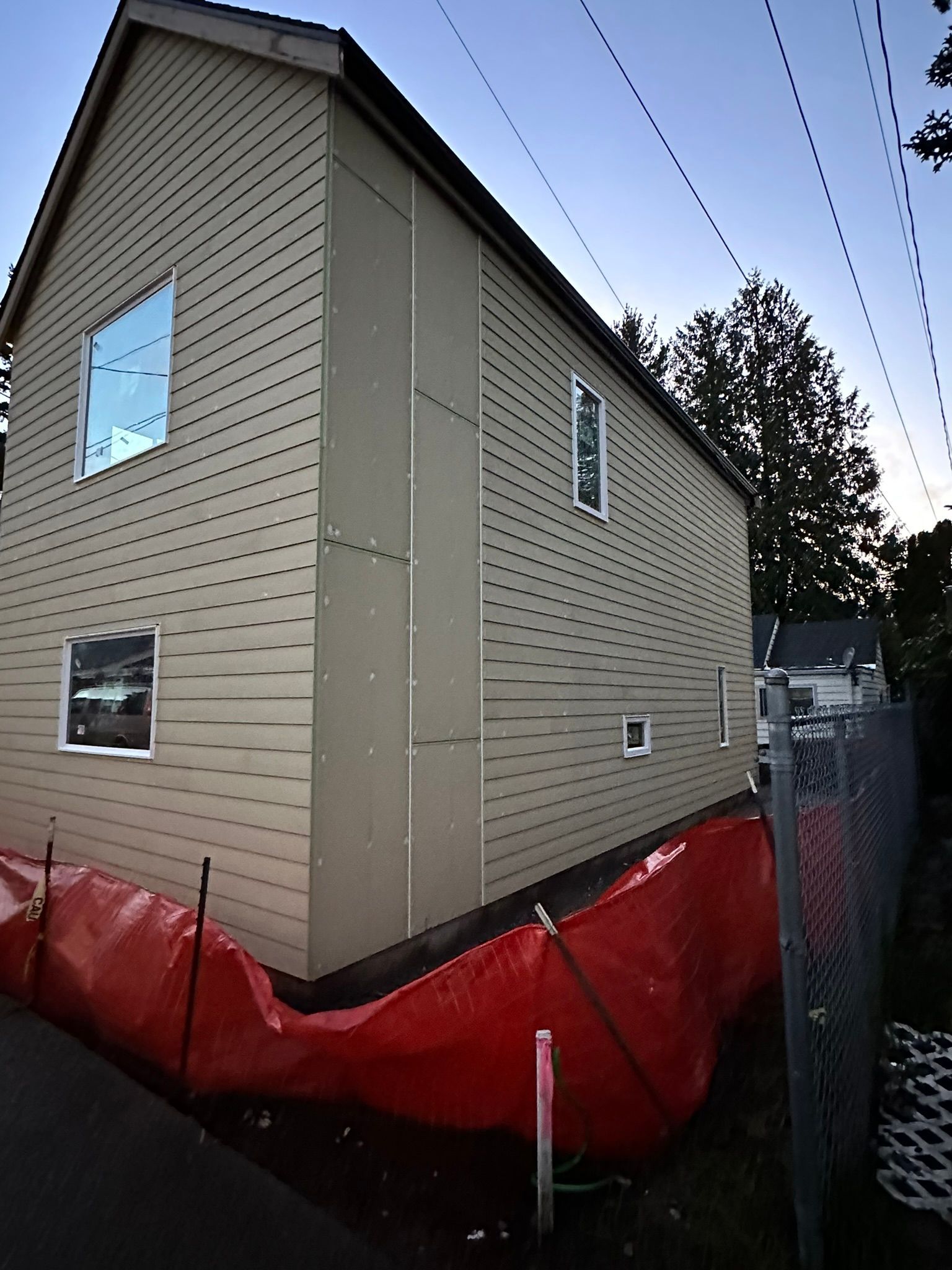 A house with a red fence around it