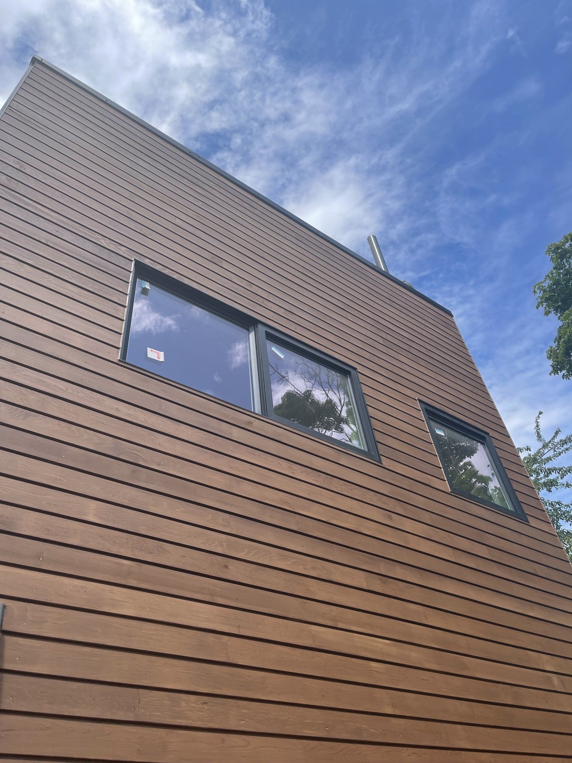 Looking up at a house with a blue sky in the background