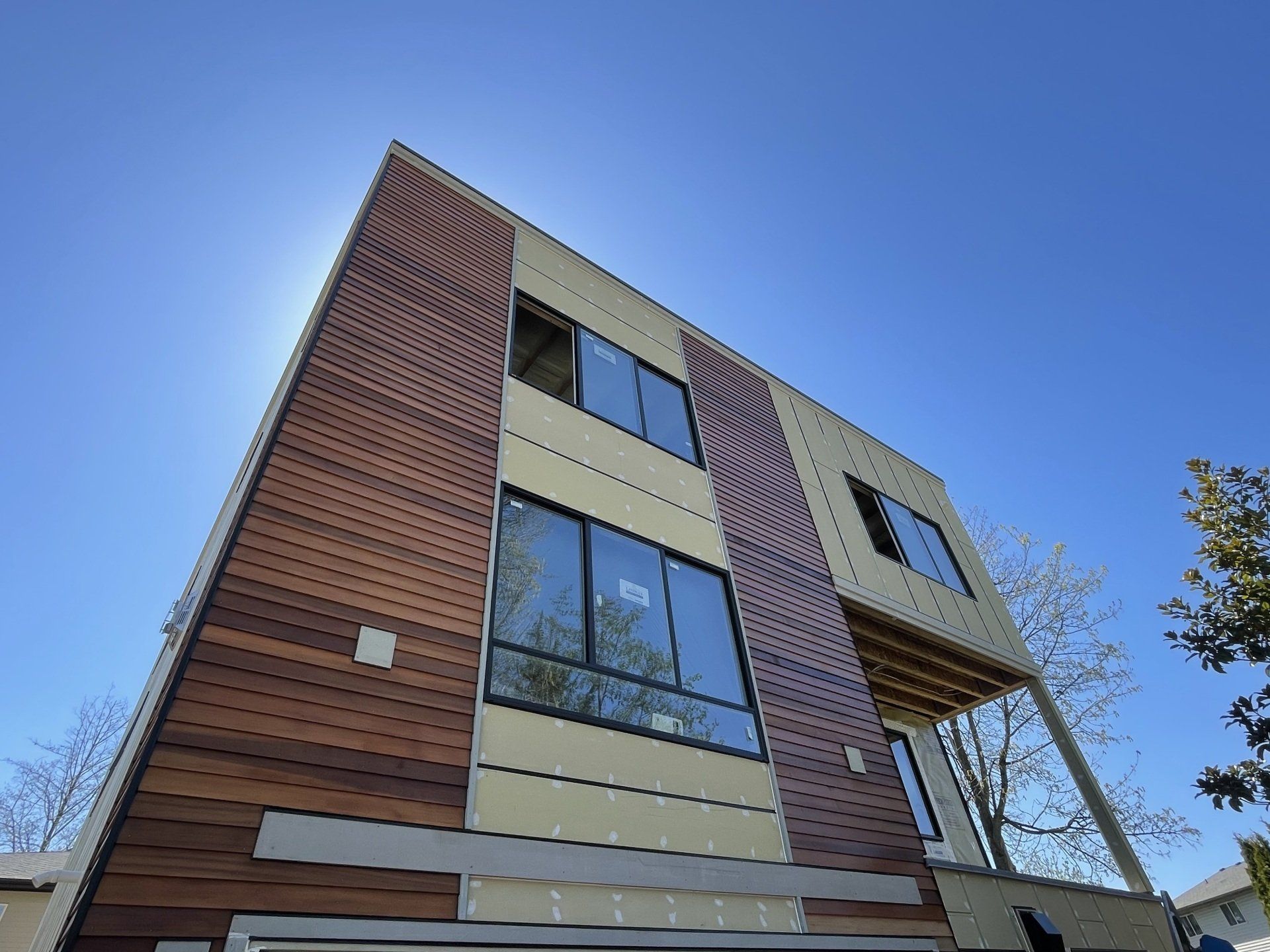 A building with a lot of windows and a blue sky in the background
