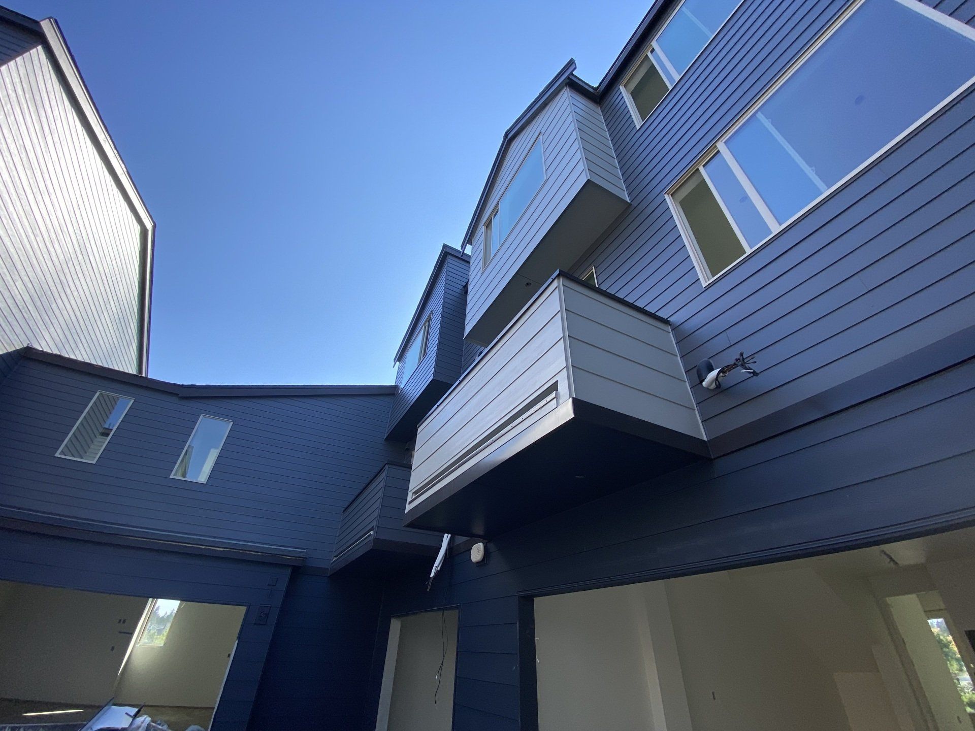 Looking up at a building with a blue sky in the background