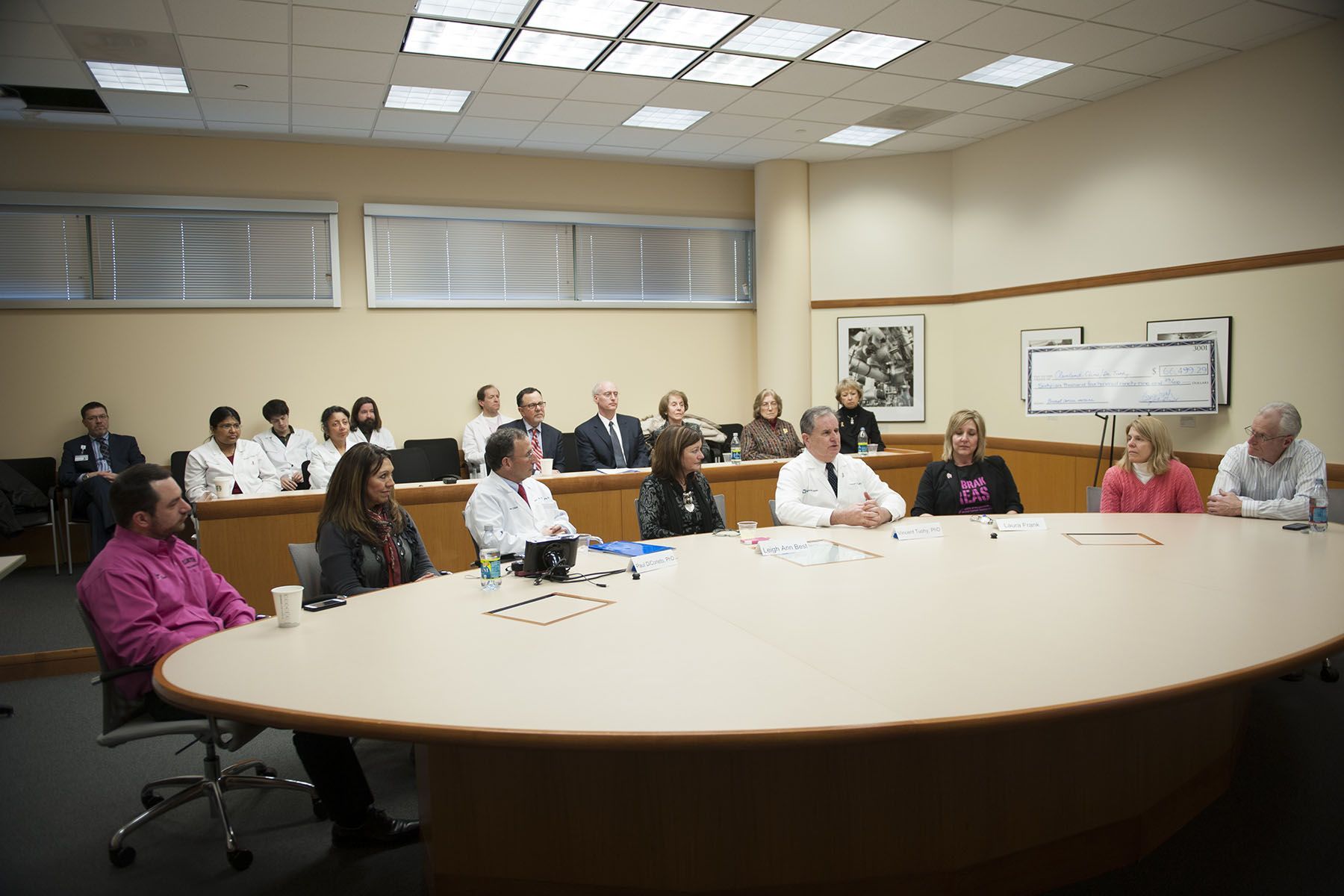 Dr. Tuohy discussing at conference table | Brakes For Breasts