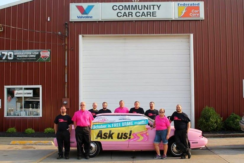 Community Car Care posed around pink car | Brakes For Breasts
