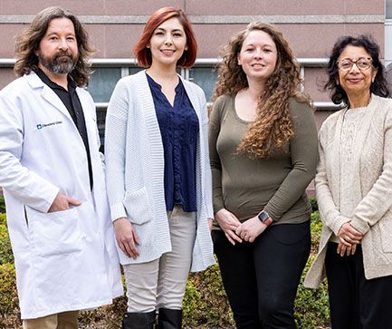 Group of doctors and team outside | Brakes For Breasts